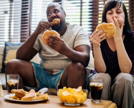 Couple eating at home