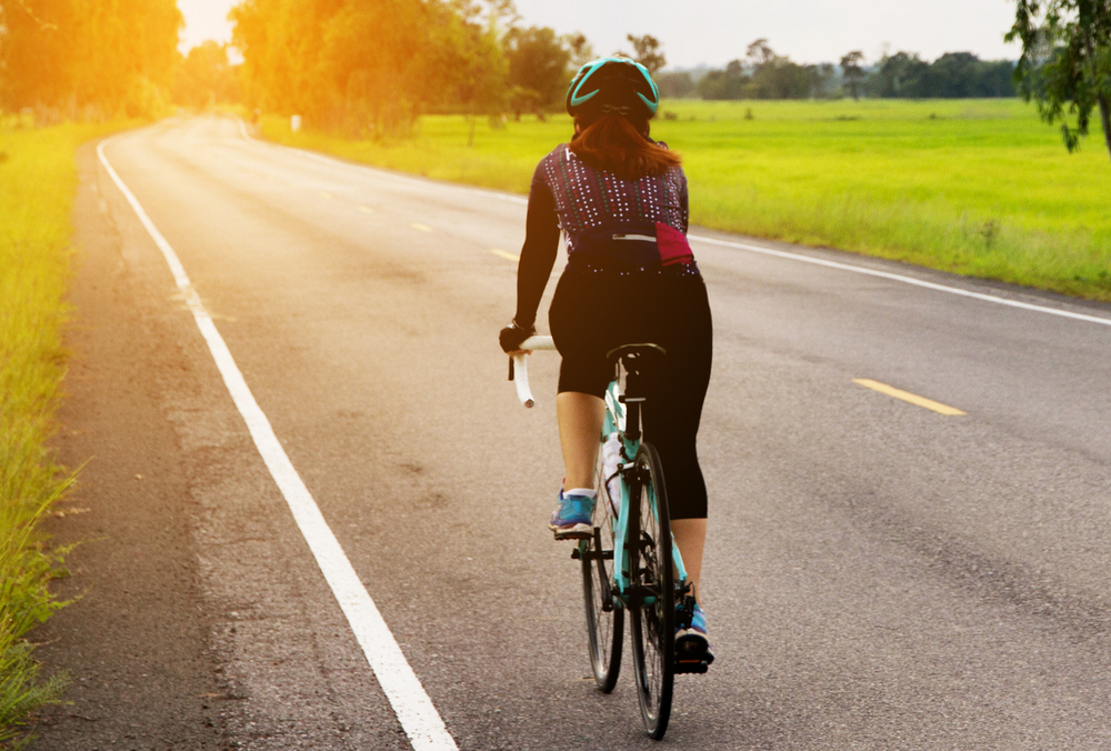 Woman cycling for weight loss