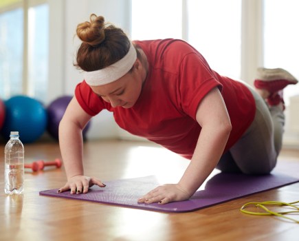 Curvy woman exercising