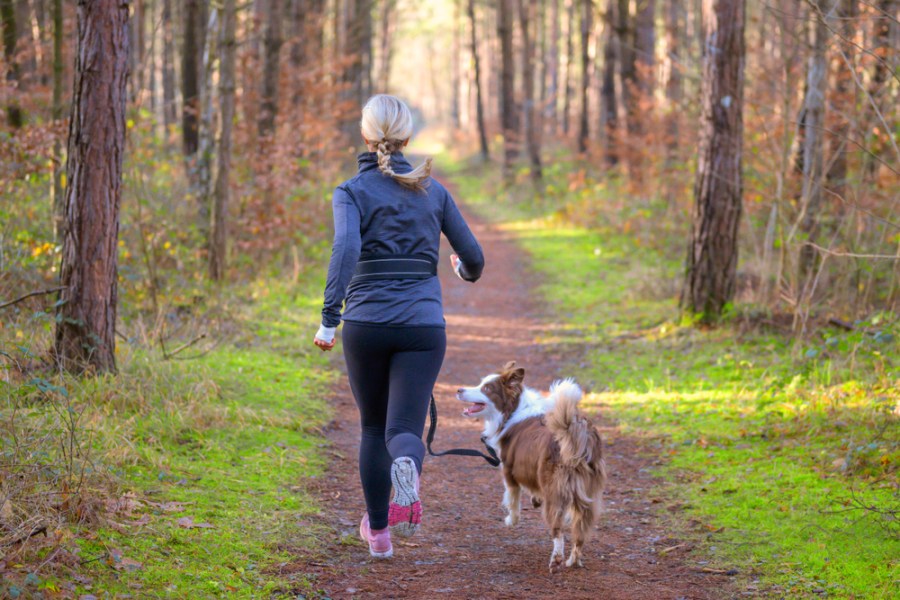 Woman running with her dog