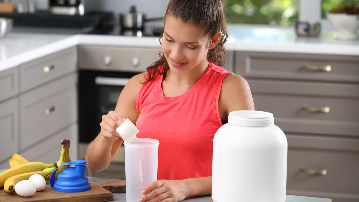 woman making protein smoothie protein shake protein powder