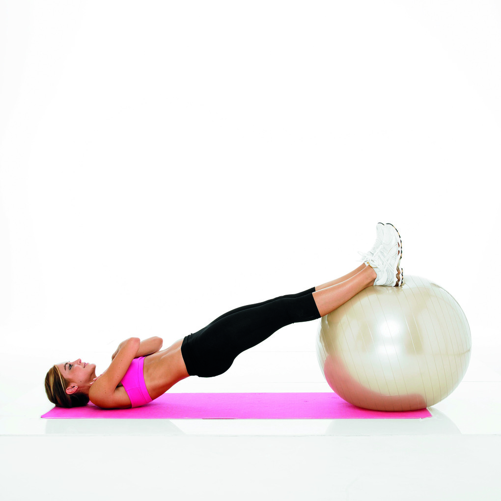 stability ball bridge with arms crossed demonstration