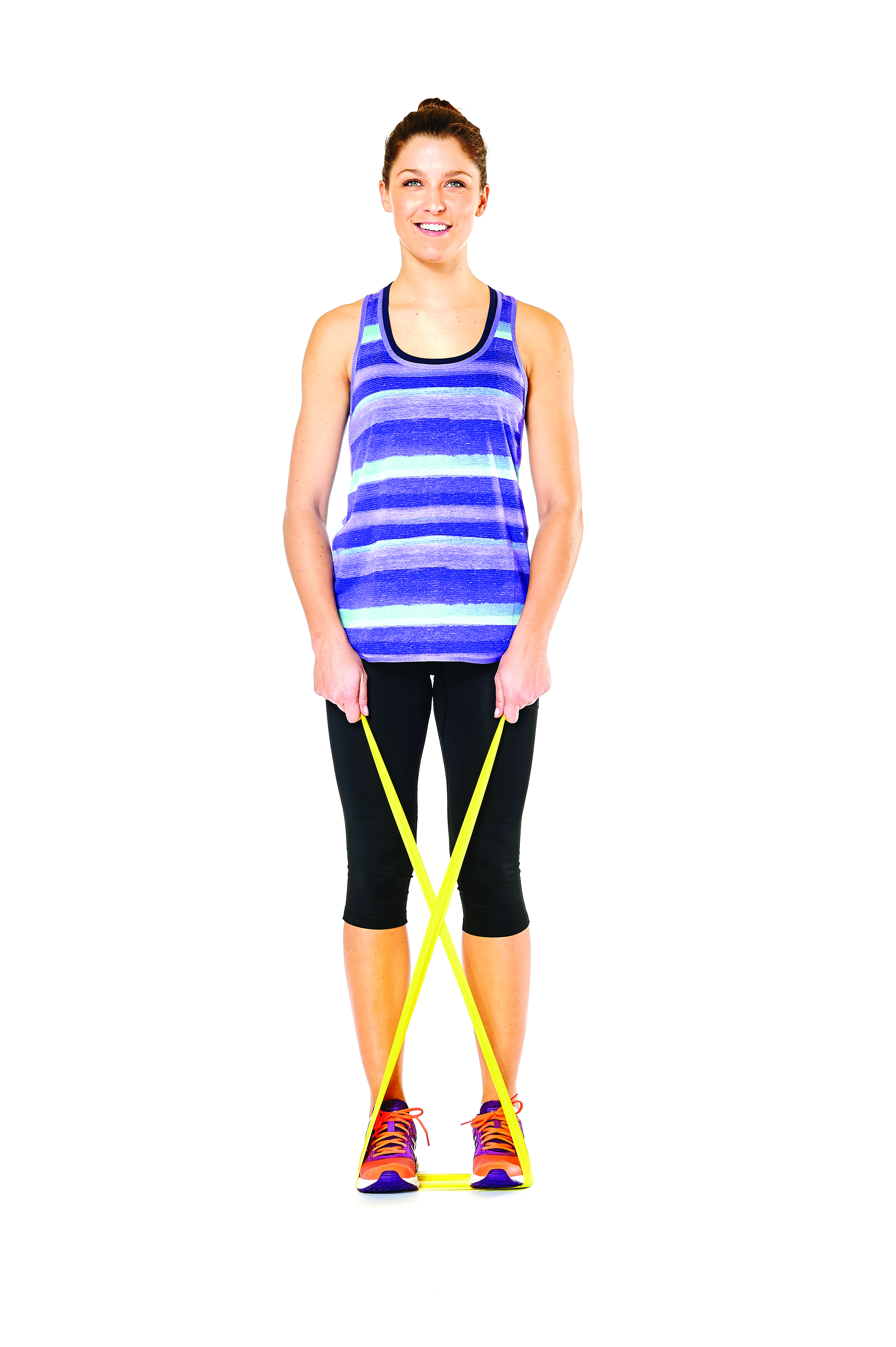 woman demonstrating crab walks in 15 minute resistance band workout
