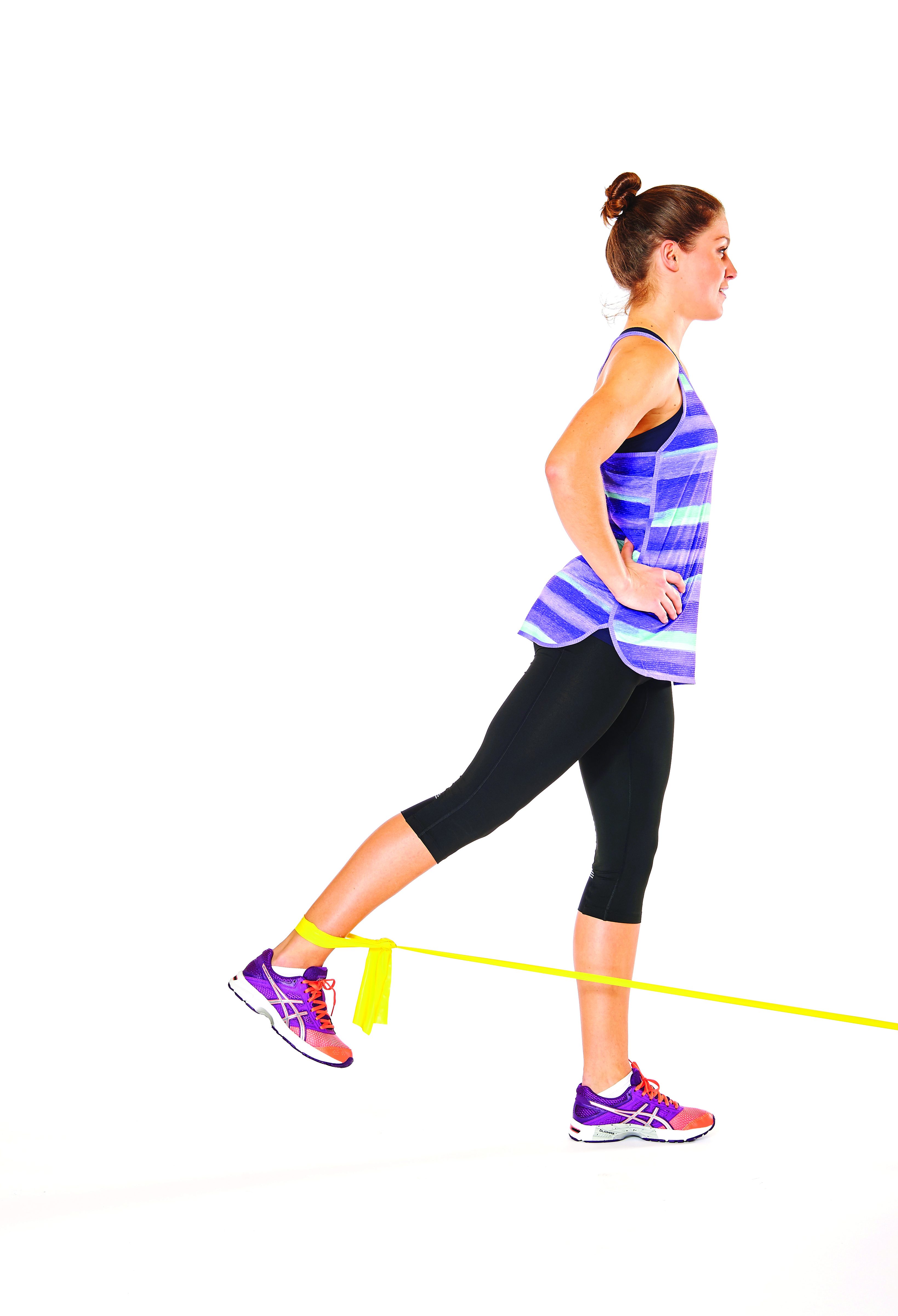 woman demonstrating glute lifts in 15 minute resistance band workout