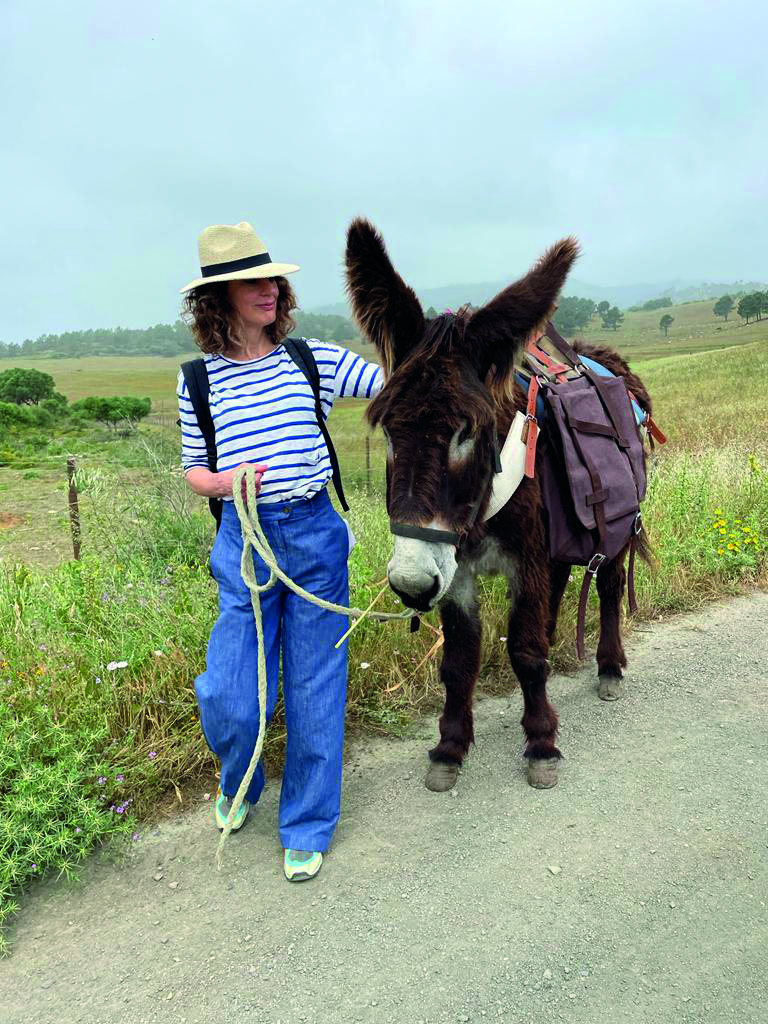 woman and donkey hiking eco trekking trail in cascais portugal