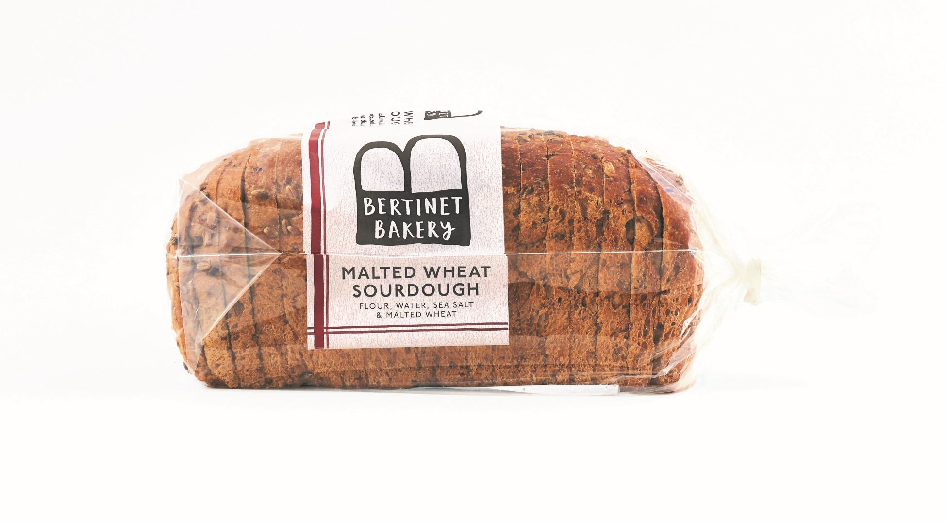 cut out image showing seeded sourdough loaf of bread from bertinet bakery on white background