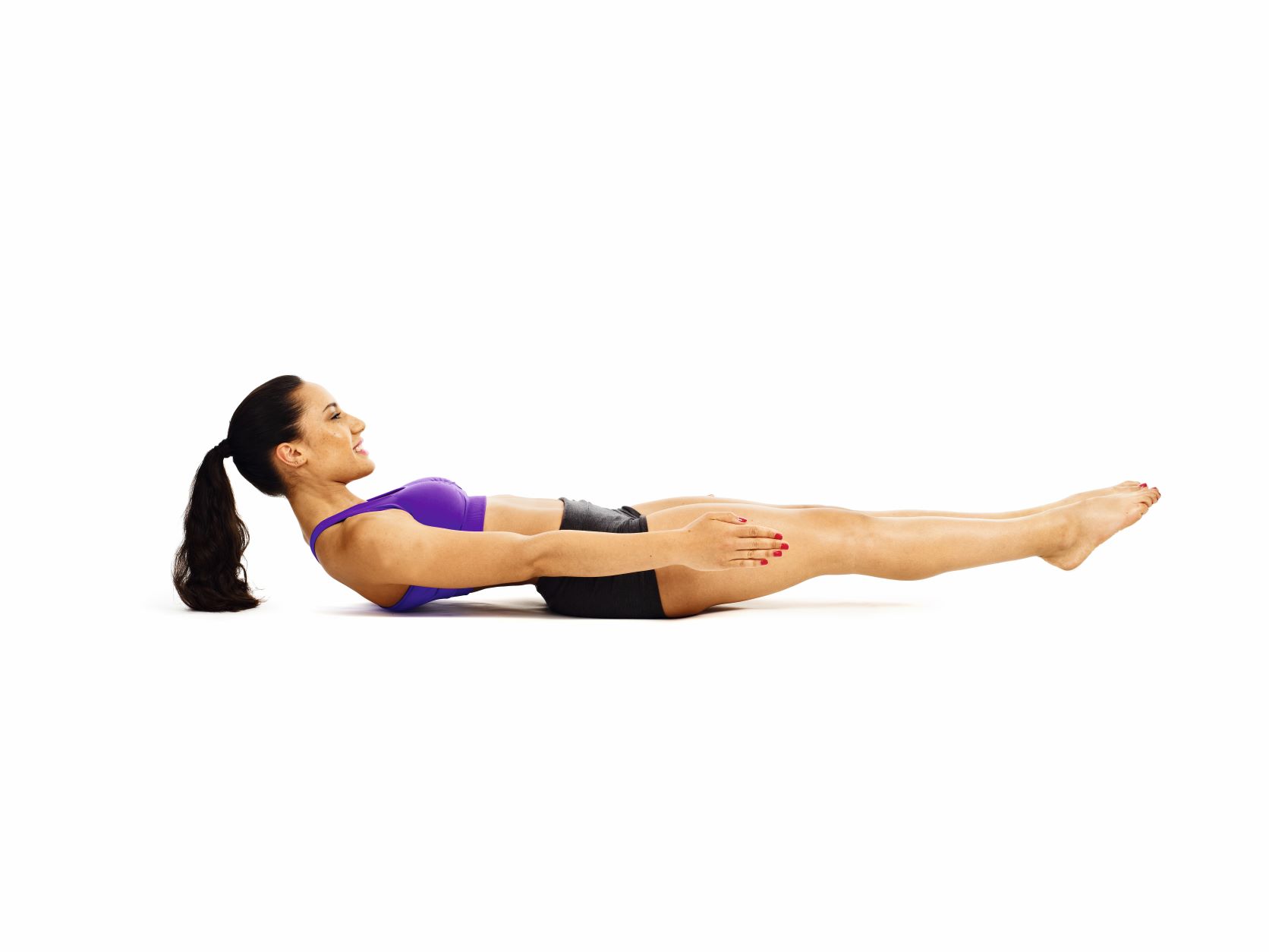 woman demonstrating dynamic boat pose in fat burning yoga workout