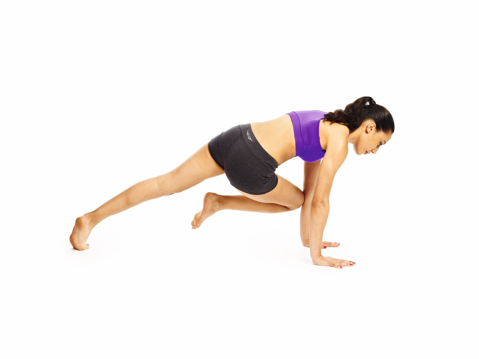 oman demonstrating twisting plank pose in fat burning yoga workout