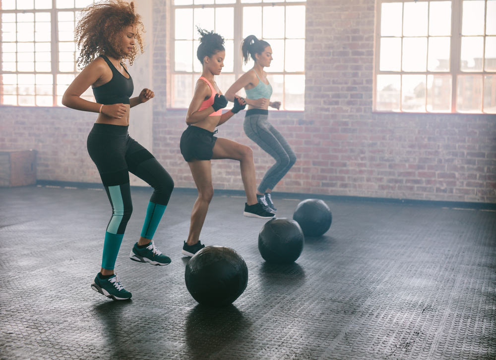 women at the gym taking part in a fitness class