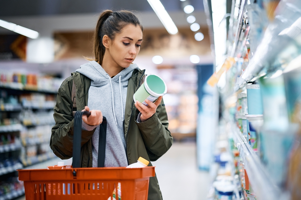 woman reading food product labels