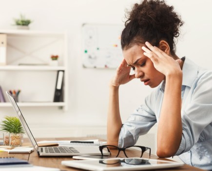 stressed woman at desk working