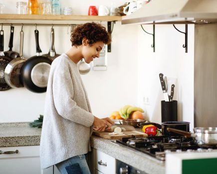 woman cutting vegetables making healthy lunch