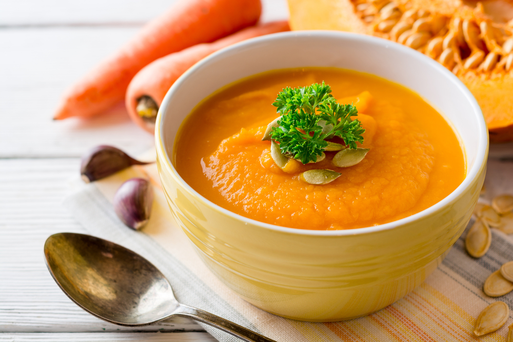 carrot soup topped with seeds and parsley healthy lunch ideas