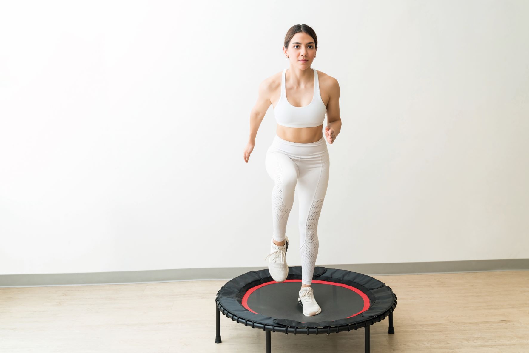woman rebounding on small trampoline fun ways to get fit