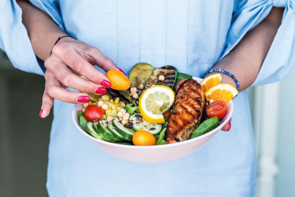 woman eating healthy chicken salad menopause nutrition