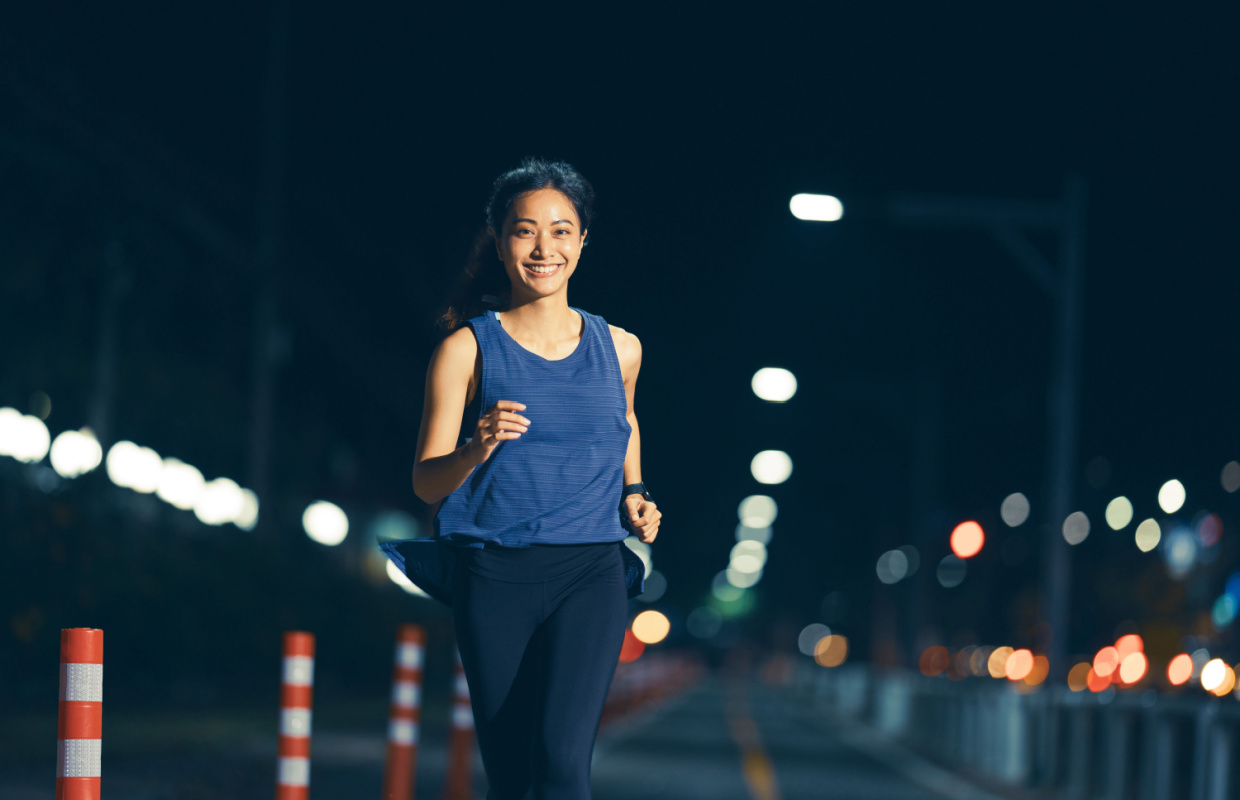 woman running at night evening 