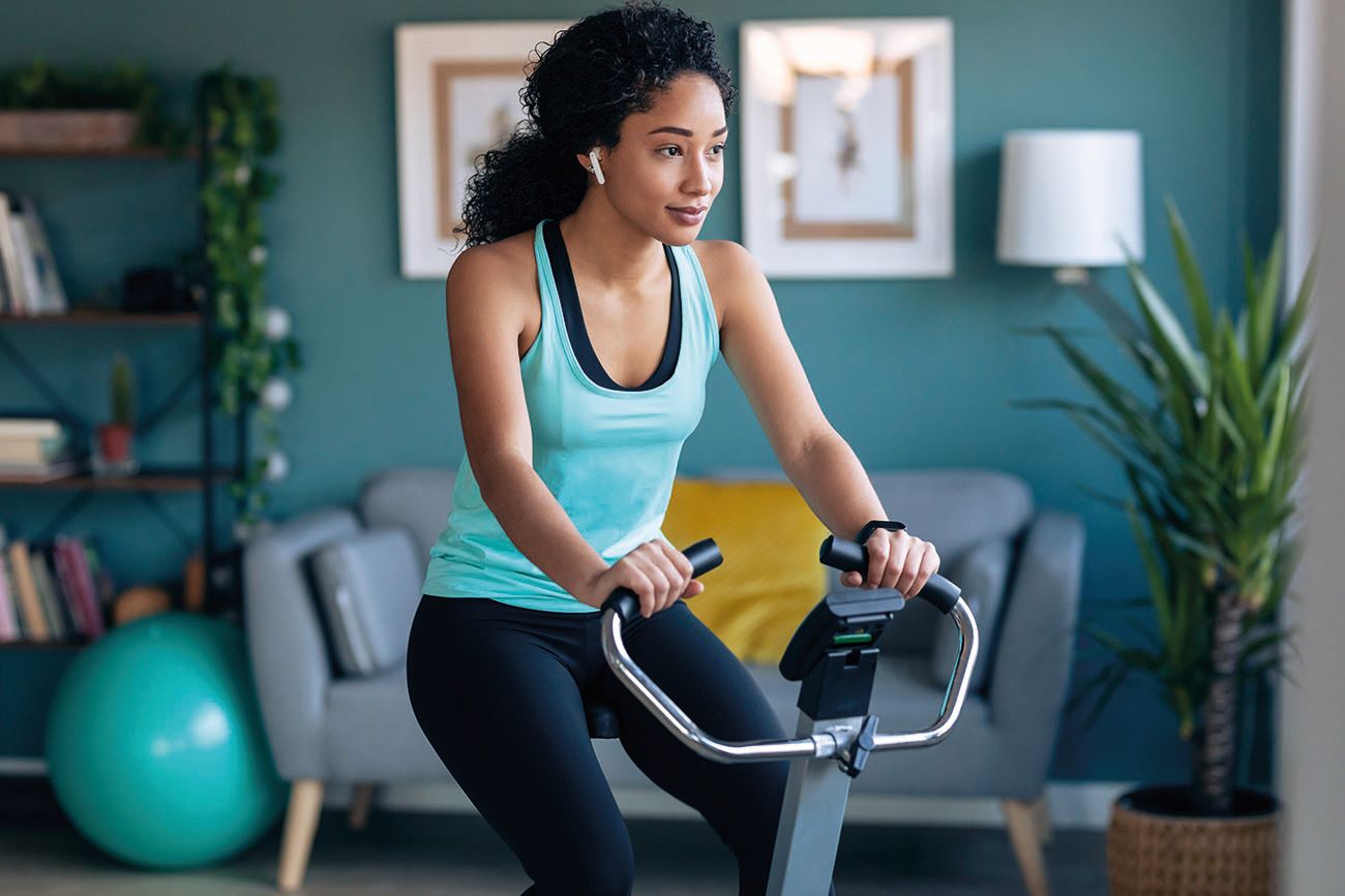 woman using indoor bike