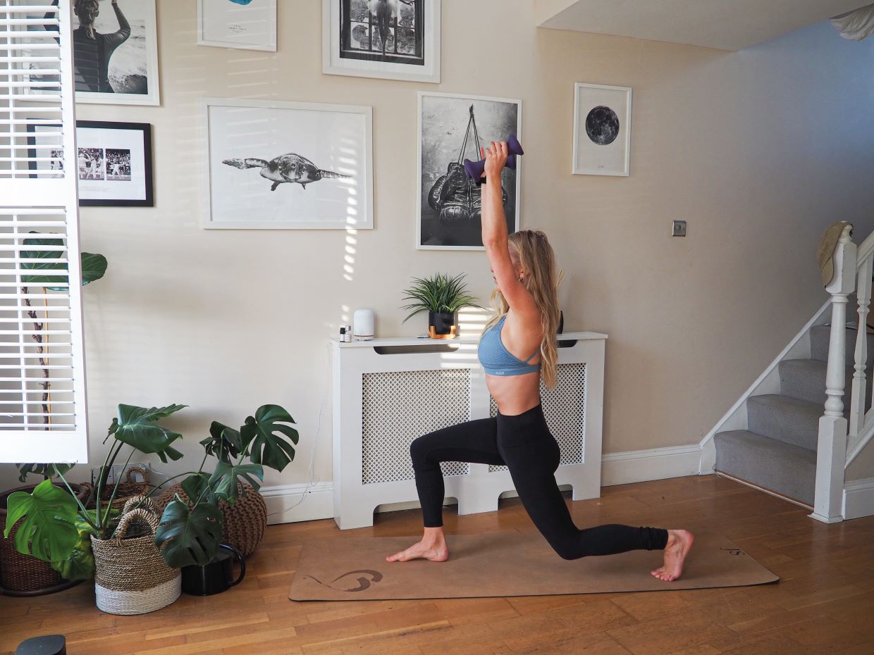 woman demonstrating lunge exercise in 10 minute home workout for busy schedules