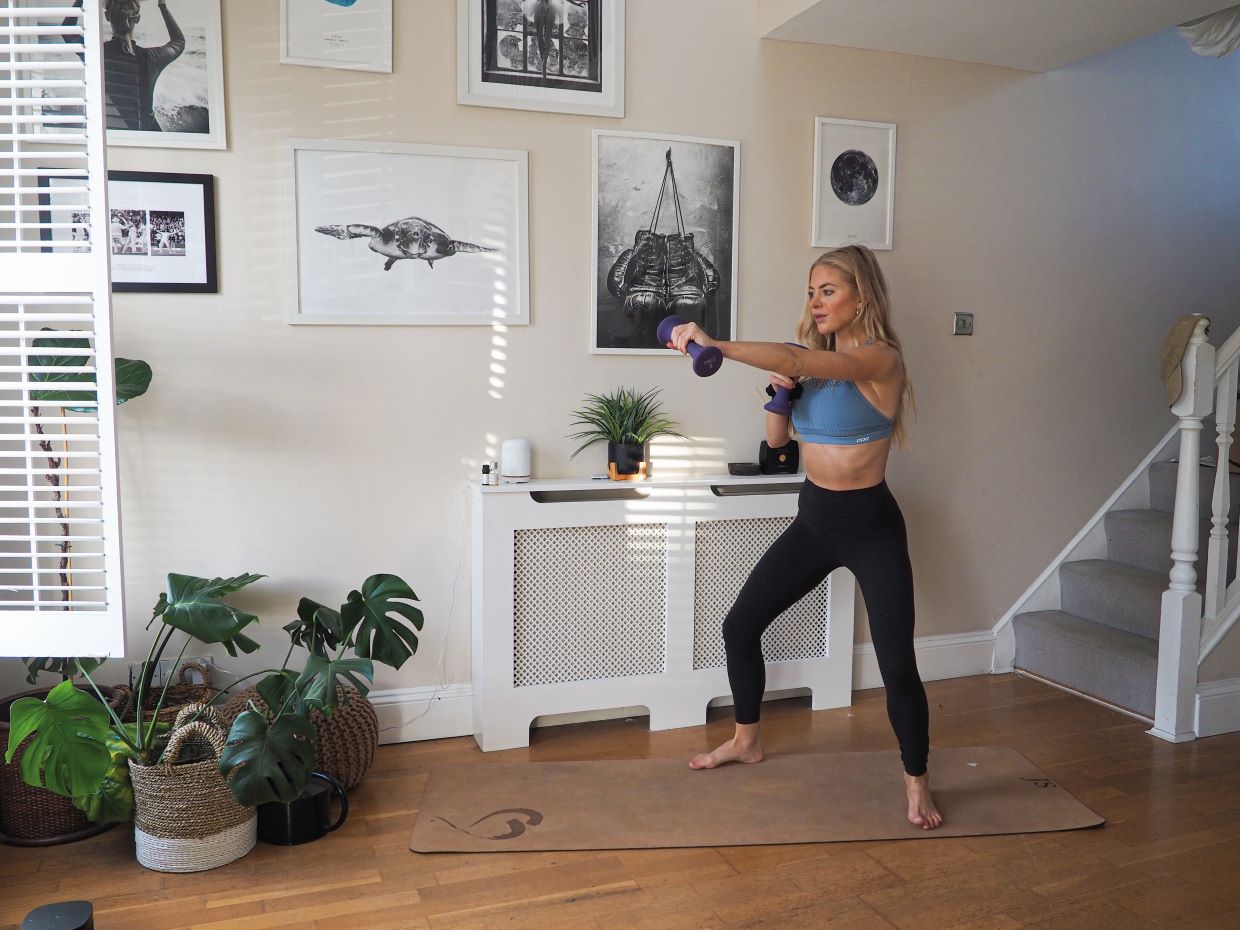 woman demonstrating punch exercise in 10 minute home workout for busy schedules