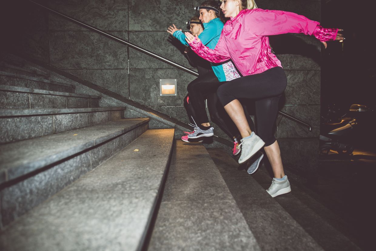women running together in the dark