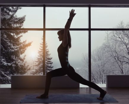 woman doing yoga in winter