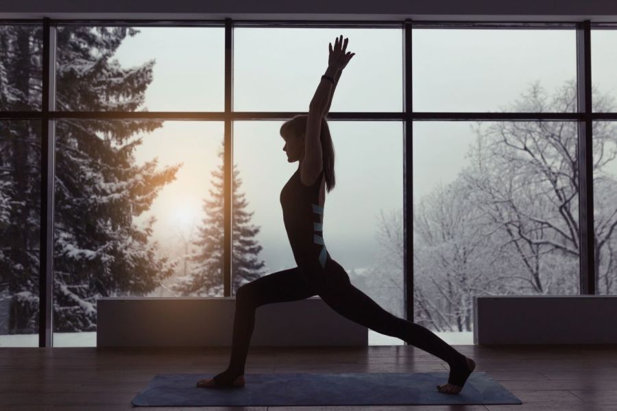woman doing yoga in winter