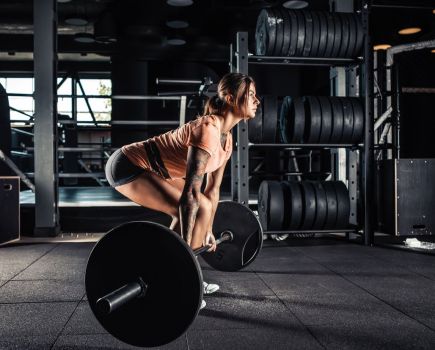 woman strength training at the gym
