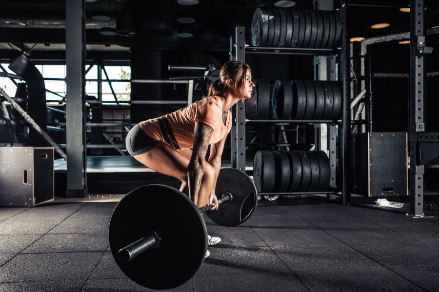 woman strength training at the gym