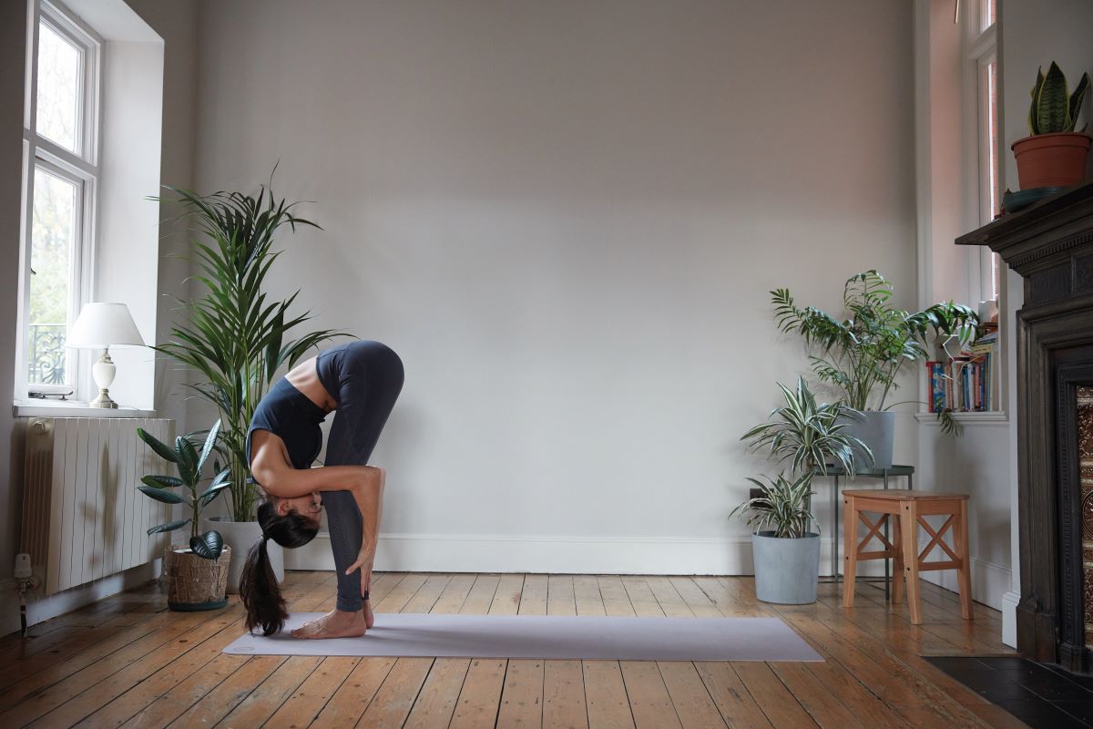 woman demonstrating yoga forward fold