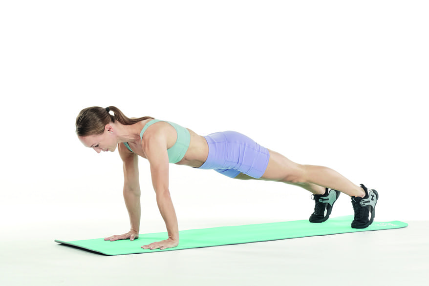 woman demonstrates mountain climbers