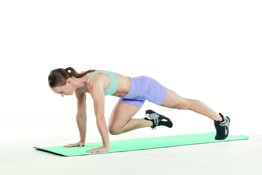 woman demonstrates mountain climbers full body 10 minute workout