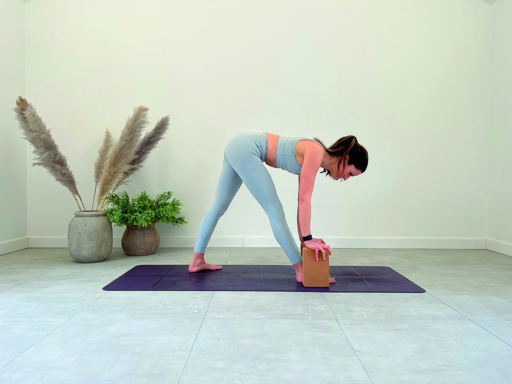 pyramid pose demonstration in yoga sequence for runners