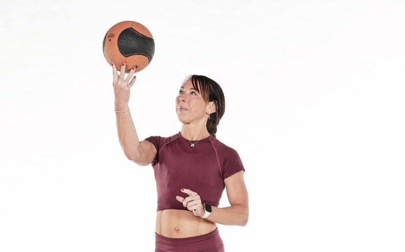 woman demonstrates best medicine ball exercises for beginners