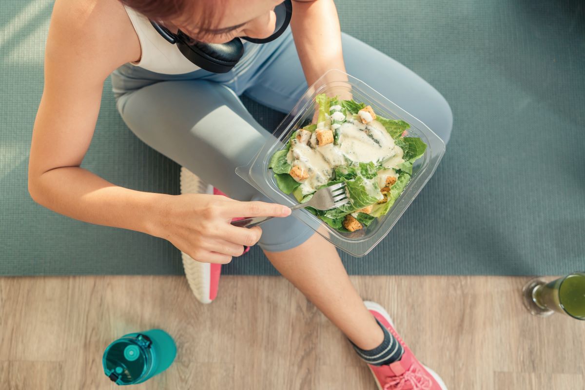 fitness woman eating salad