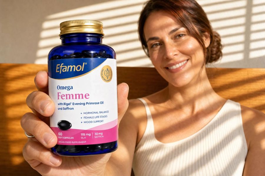 woman holding bottle of efamol omega femme supplements