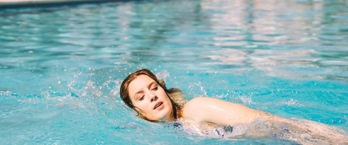 woman swimming swimmer's ear