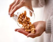 woman holding walnuts