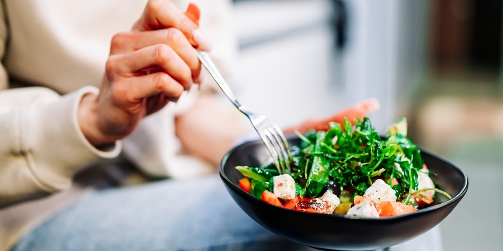 unrecognisable woman eating healthy meal, good quality food concept