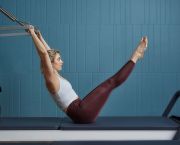 woman tower pilates exercise class