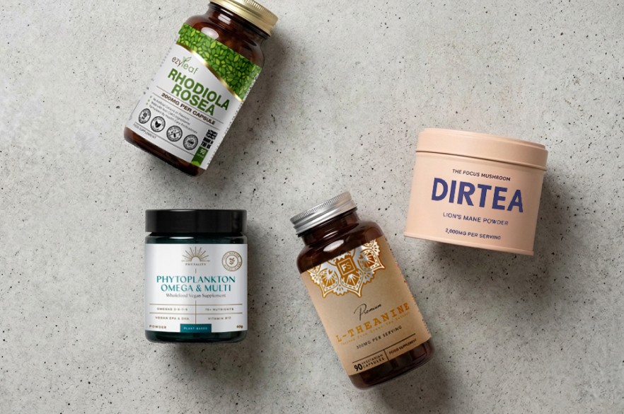 group shot of different nootropics supplement products, including ezyleaf rhodiola rosea, DIRTEA lion's mane powder, L-theanine and phytoplankton omega
