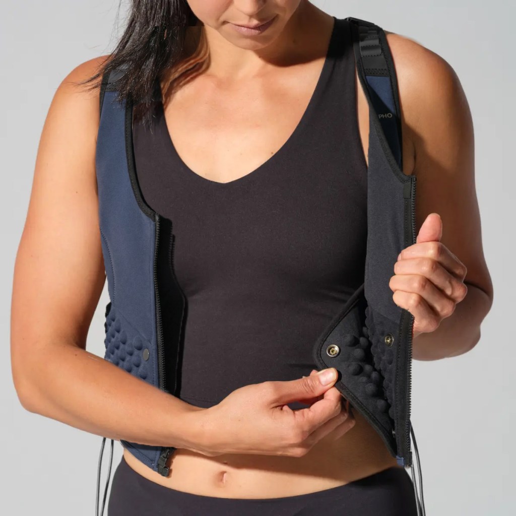 woman demonstrating how to add G-Pack to G-Vest Icon