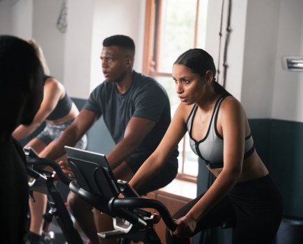 man and woman doing a cardio workout in the gym