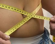 Woman with tape on belly