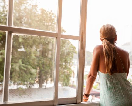 Woman looking out of window