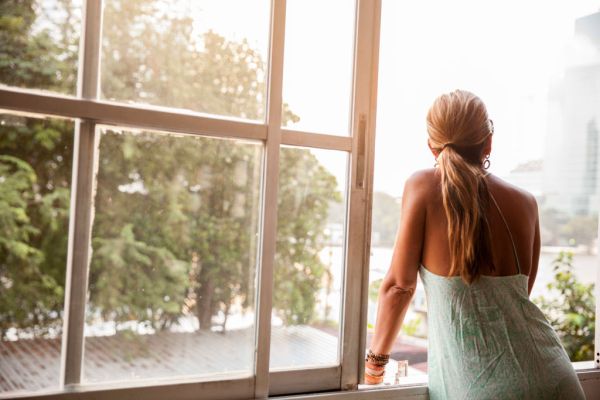 Woman looking out of window